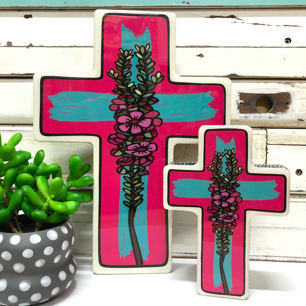 A luscious mix of bright colour & native Australian Geraldton Wax, the Geraldton Wax Pop Cross is a combination of hand drawn & printed illustrations with a dash of mixed media, gorgeous fabrics, wood & resin. You can hang your cross on the wall or stand it in amongst your treasures or indoor plants for a pop of unexpected colour.