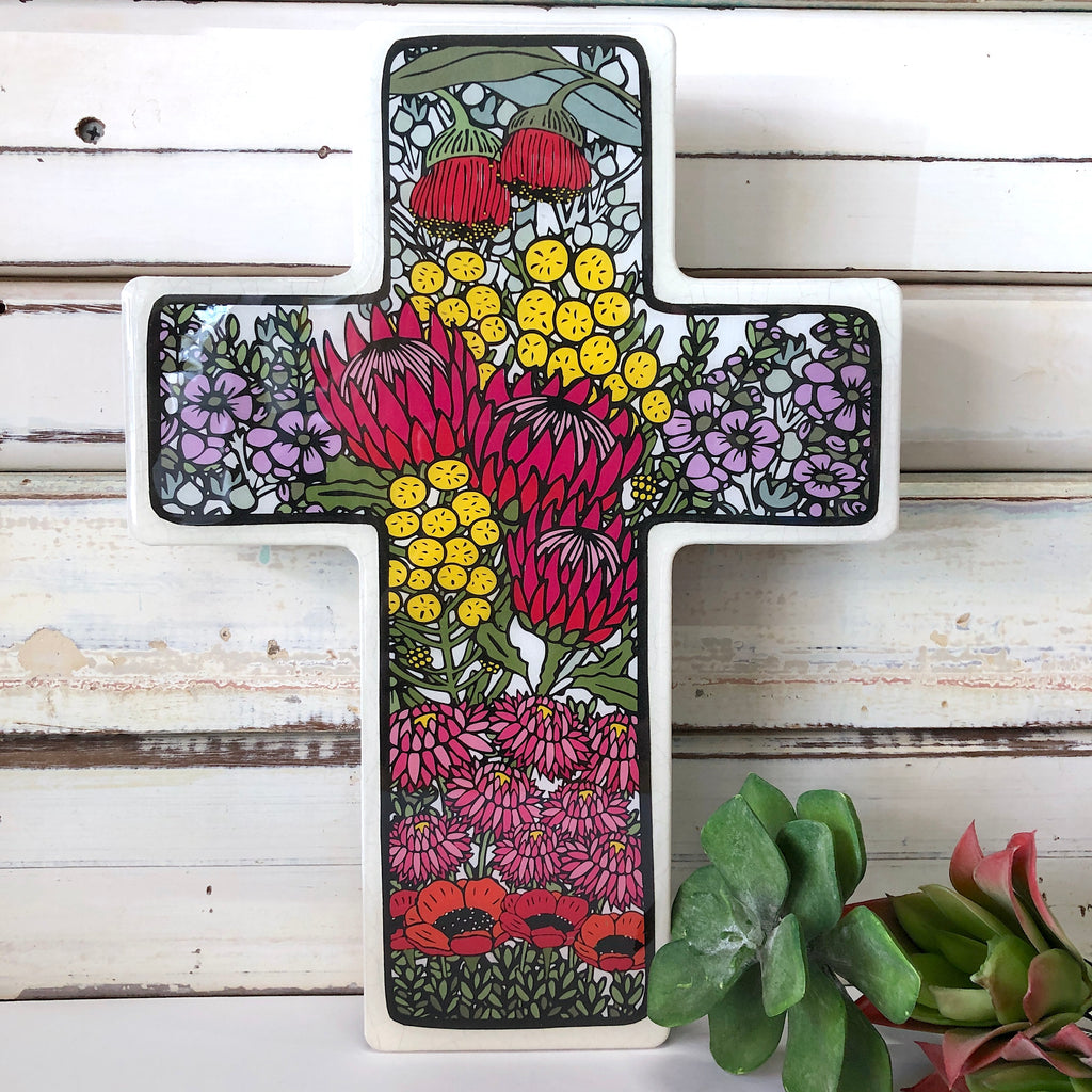 The Lost & Found Cross is a combination of hand drawn & printed illustrations mixed with a dash of mixed media, gorgeous fabrics, wood & resin. You can hang your cross on the wall or stand it in amongst your treasures or indoor plants for a pop of unexpected colour.